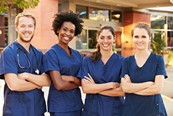 group of nurses standing outside