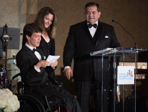 Micah Fowler along with his parents Tammy and David, share their thanks at the Children's Specialized Hospital Gala