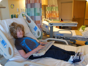 Liam in a hospital bed