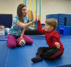jude high-fiving physical therapist
