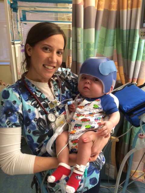 nurse holding baby owen
