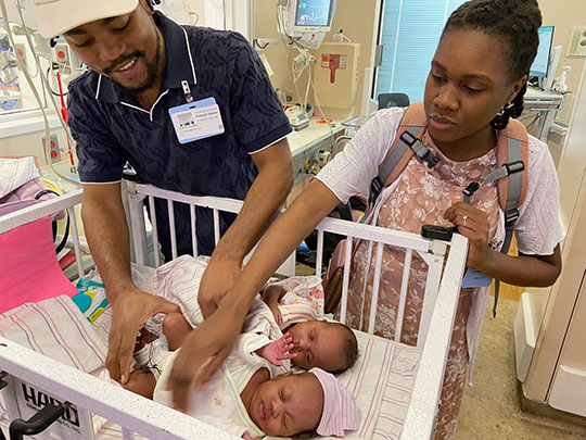 Mom and Dad with the twins in the hospital