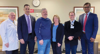 Debbie, husband Joe and her care staff