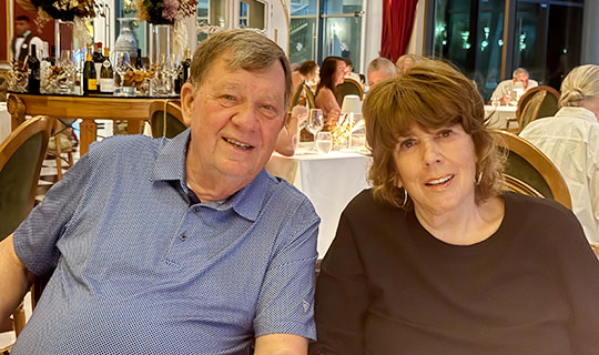 The Keneallys sitting at a table in a restaurant