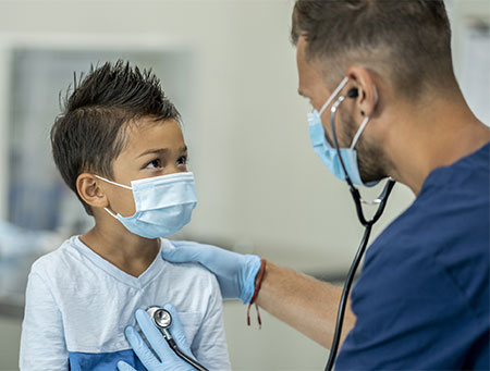 child being examined by a health care provider