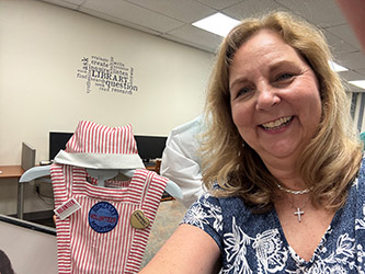 Denise Salvatore with a candy striper uniform