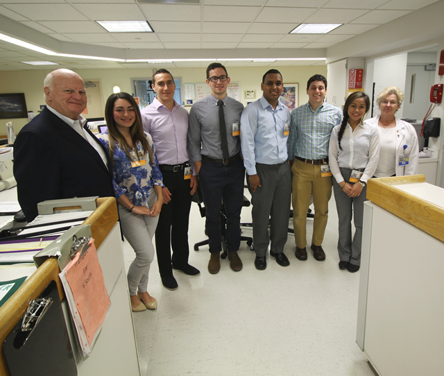 President and CEO Gary Horan (far left) poses with participating students